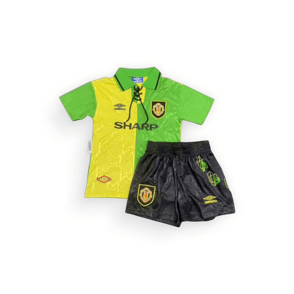 Manchester United Retro Away Kids Football Kit 1992-94, vibrant green and yellow base colour shirt with black shorts, complete with club crest and branding logo on the chest and the main sponsor logo in the centre of the shirt, on a white background - shop now