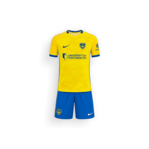 Two-piece youth away kit set for Portsmouth FC 2026-27 by Nike, featuring a yellow short-sleeve jersey with royal blue trim and the club crest, paired with matching royal blue athletic shorts.